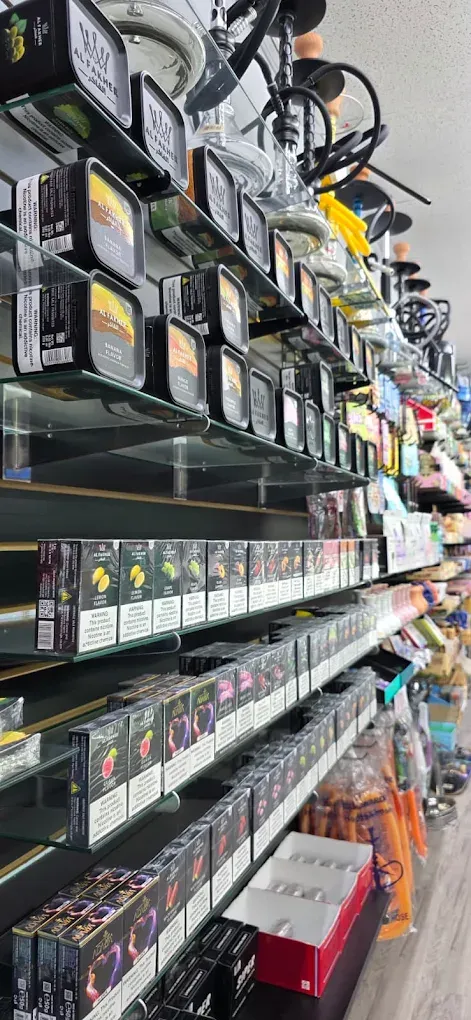 Al Fakher shisha tins and hookah bowls on the shelf at Smoke Drop Edgebrook