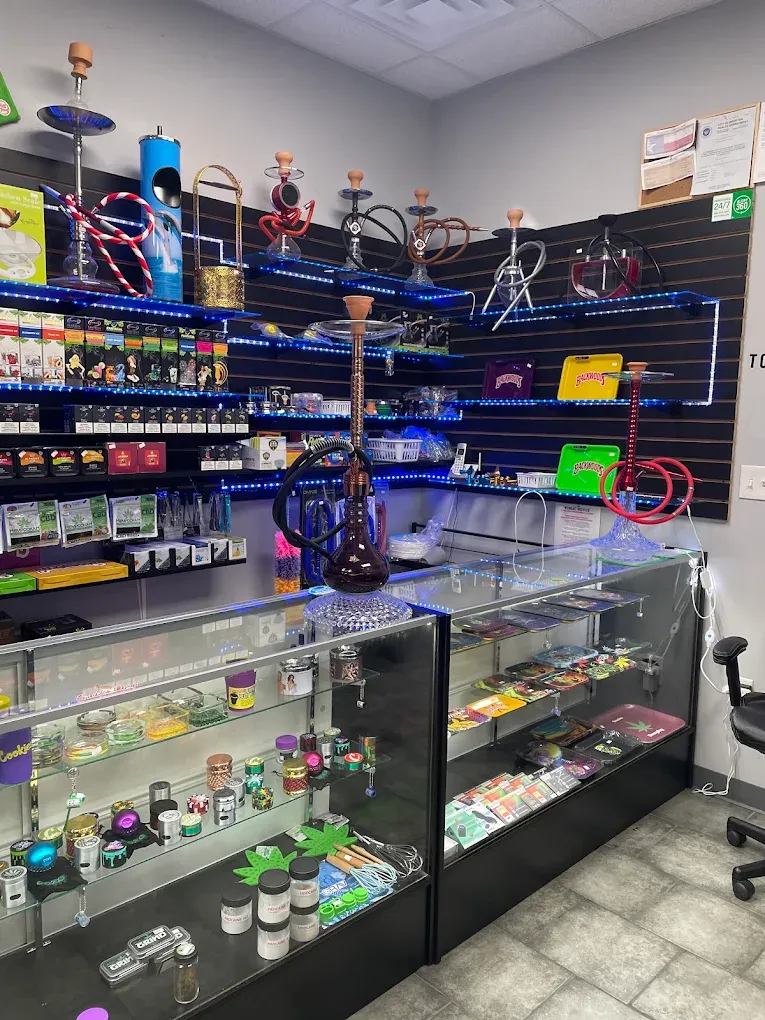 Hookah wall and glass counter at Smoke Drop Edgebrook, Houston